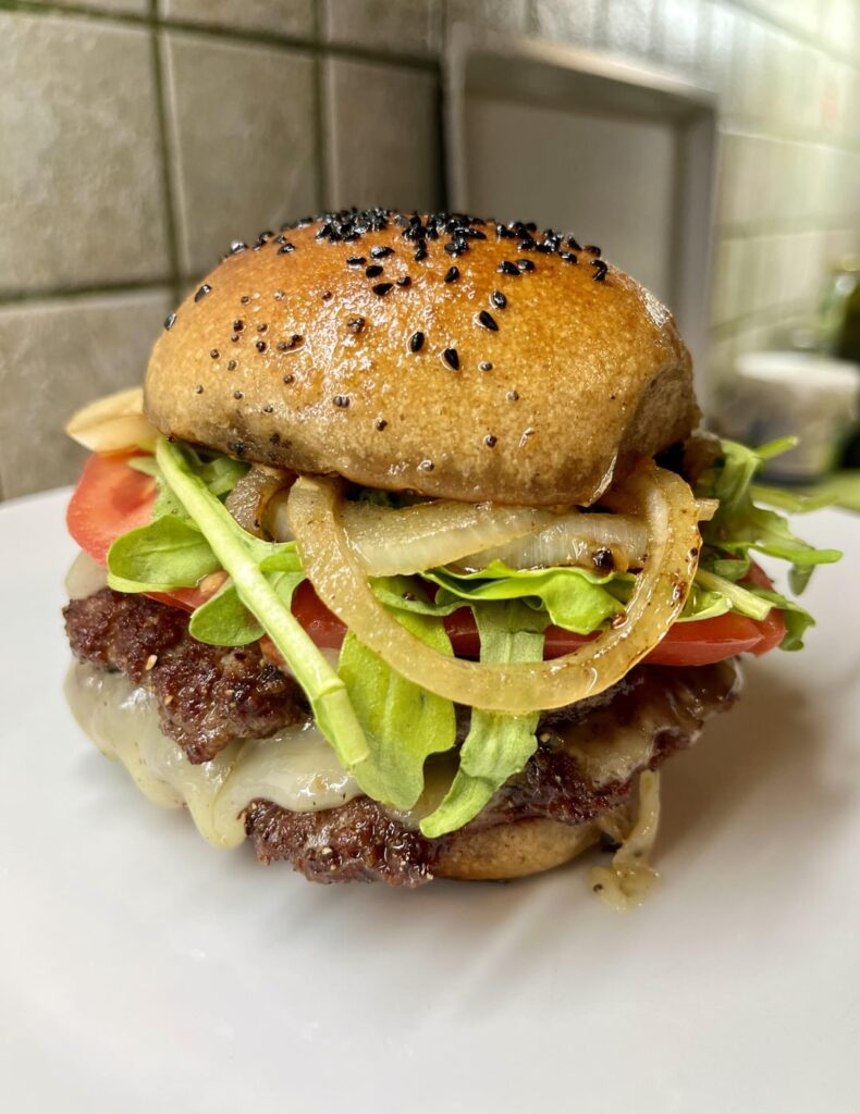 A double cheeseburger with a homemade sourdough bun | THE FAT CHAMOIS