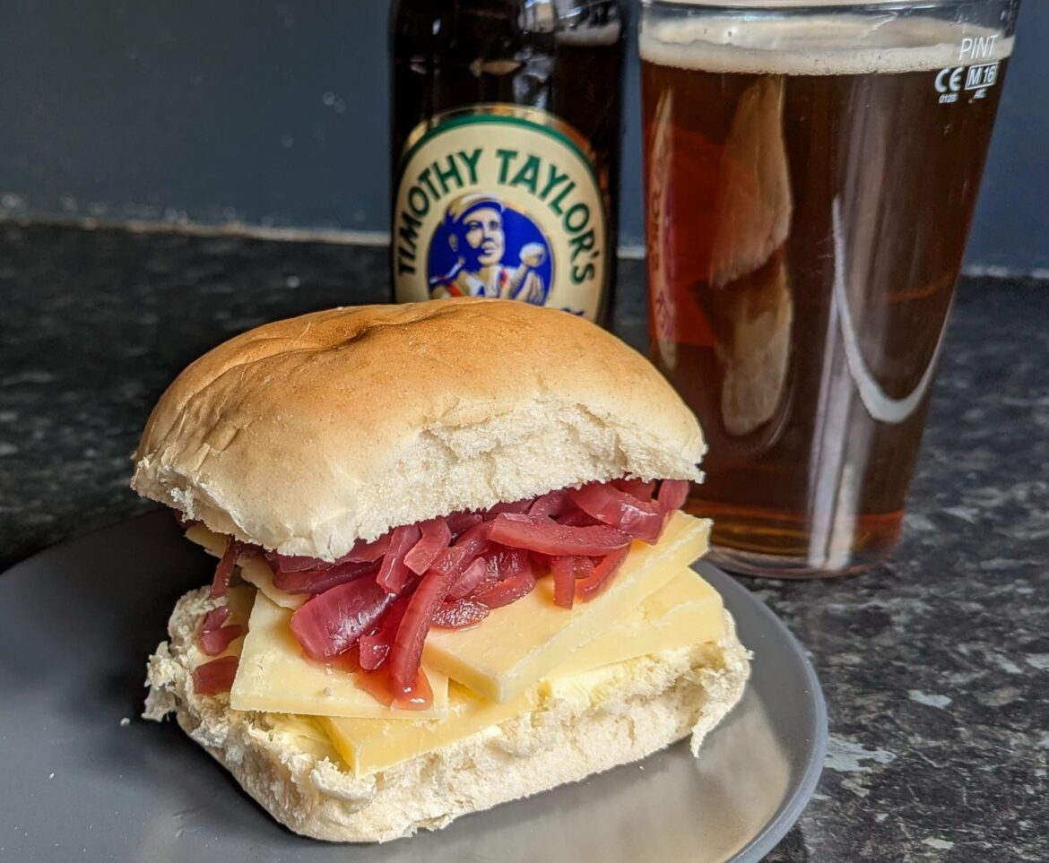 Some beautiful Lincolnshire Poacher and pickled onion. Pint of bitter on the side and it's a perfect combo