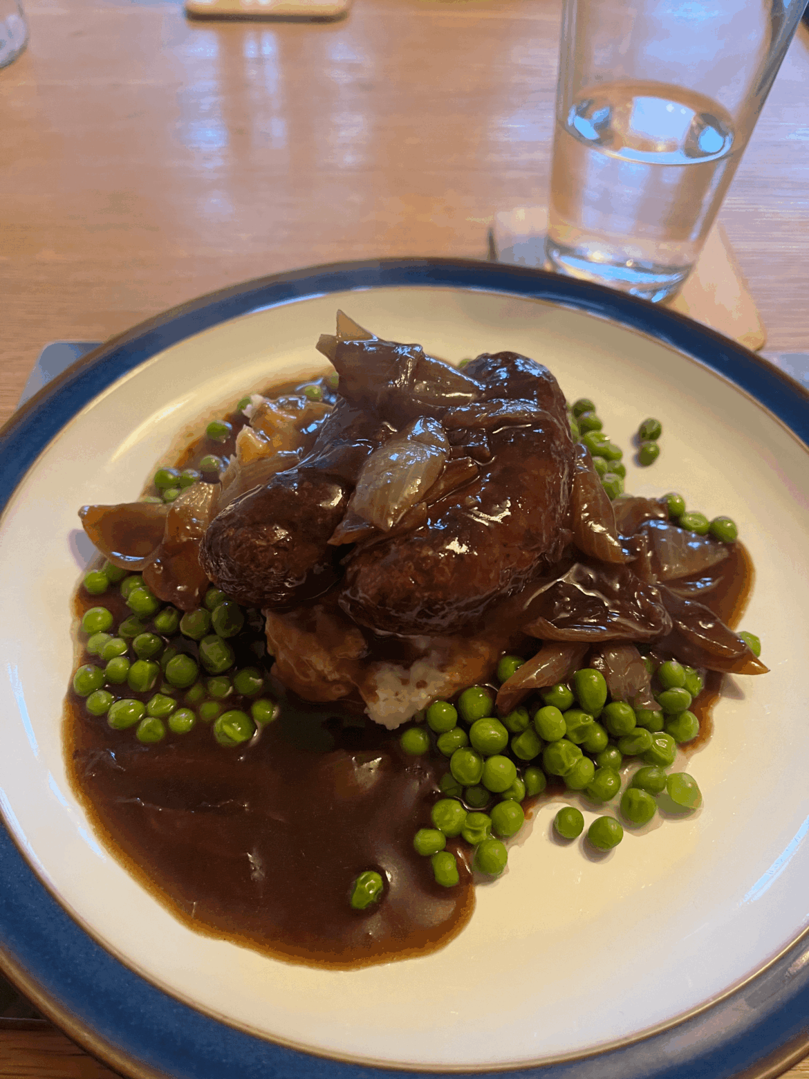 Venison bangers and mustard mash, in a red wine and onion reduction
