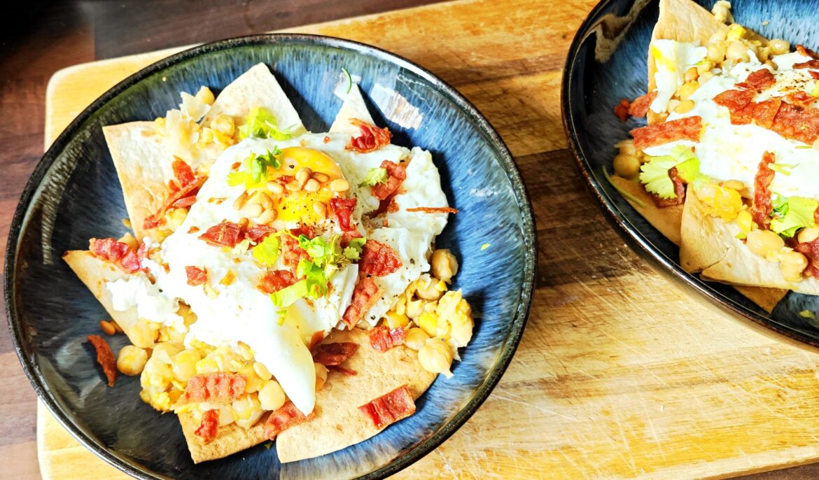 My own invention 'umbecha' middle eastern and Japanese inspired fusion: baked tortillas, softened chickpeas fried with umboshi plum and garlic, Greek yogurt with tahini, garlic and lemon oil, crispy fried runny egg, topped with pine nuts and some crispy bacon.