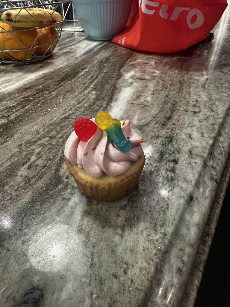 Lemon cupcake with lemon filling and raspberry jam cream cheese frosting