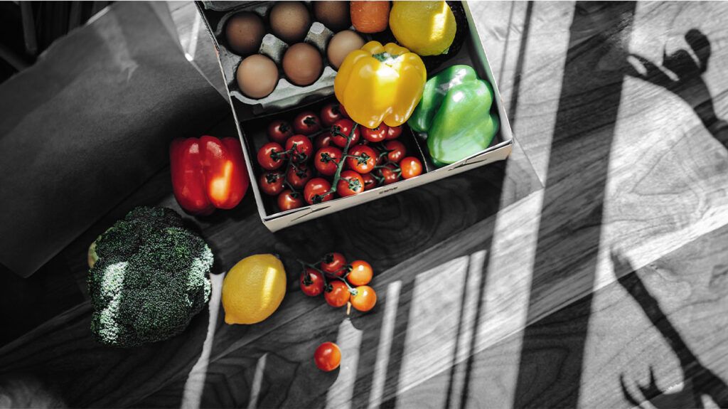 carton of eggs and crate of fruit and veg