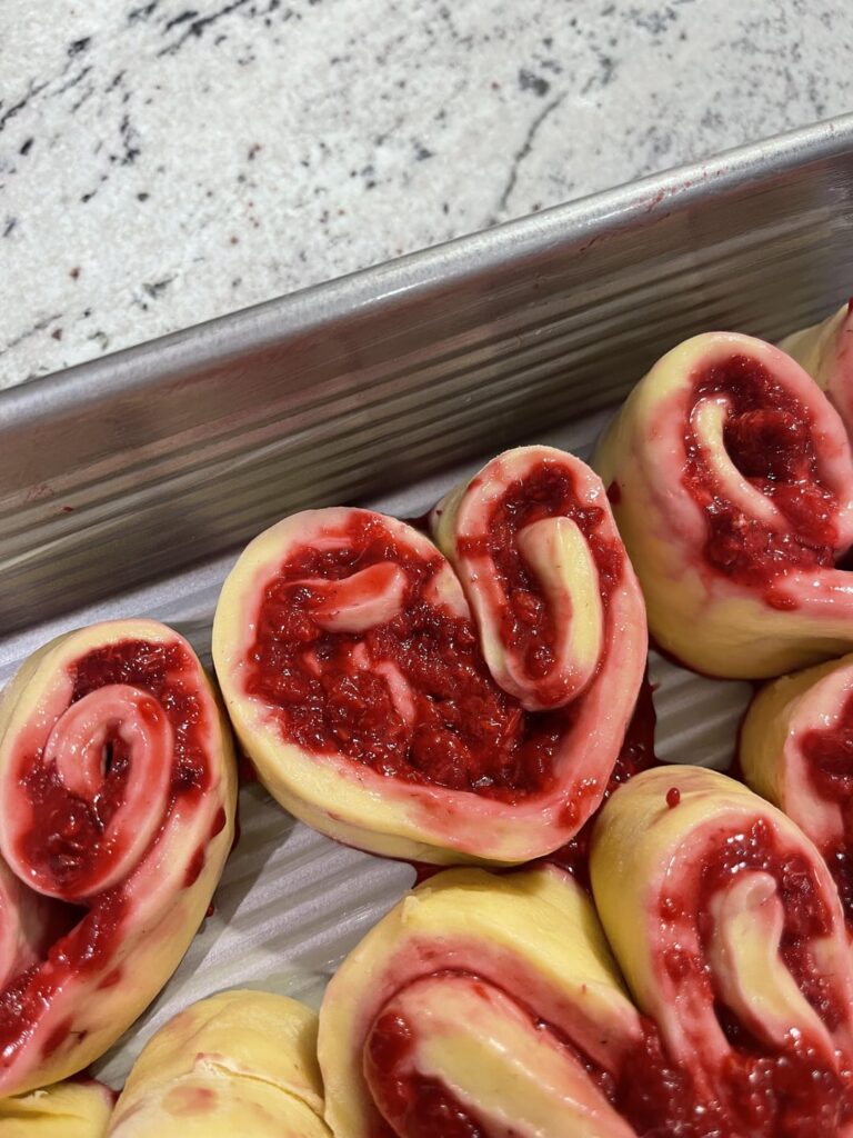 Heart shaped raspberry rolls 🤍