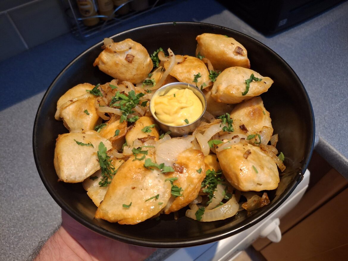 Meat pierogi in onion butter with mustard mayonnaise