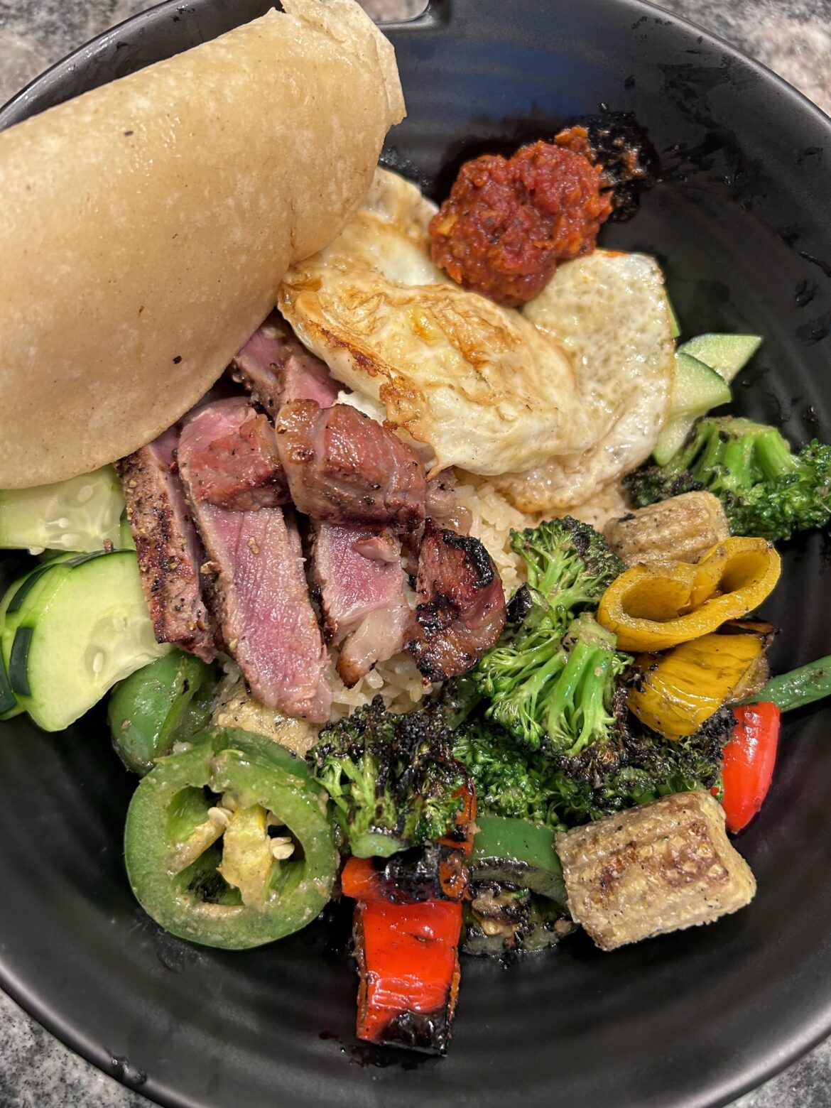 Grilled steak & veggie bowl, with fried egg.