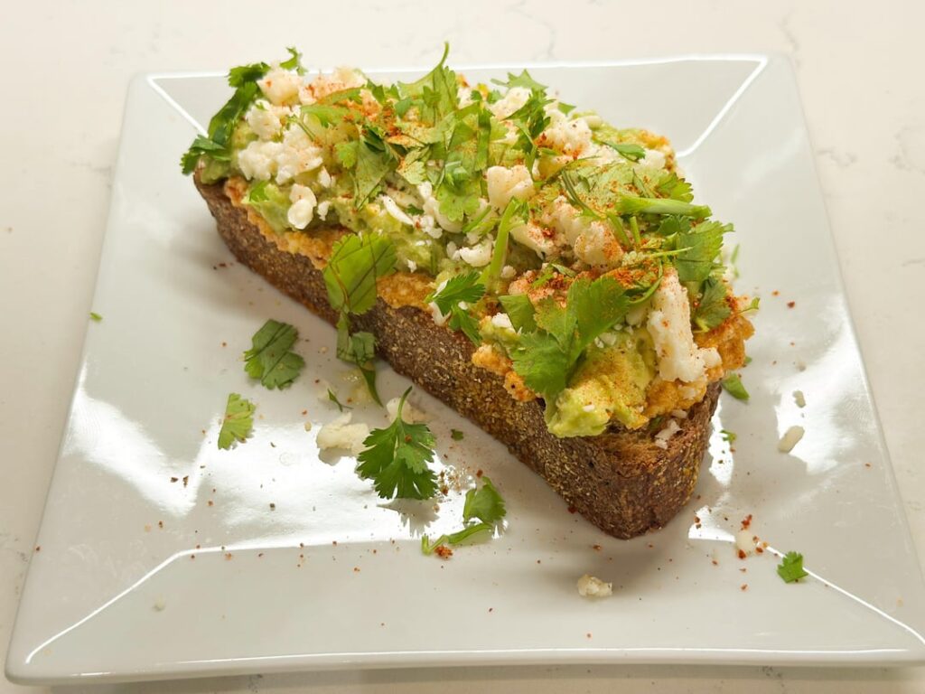 Avocado Toast With Chipotle Mayo, Cotija Cheese, Cilantro, and Lime and Avocado Toast With Cucumber, Soy Sauce, and Shichimi Togarashi by Niki Achitoff-Gray for Serious Eats