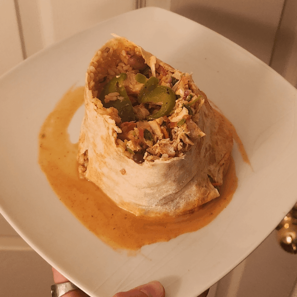 Microwaved, half-eaten, leaking burrito