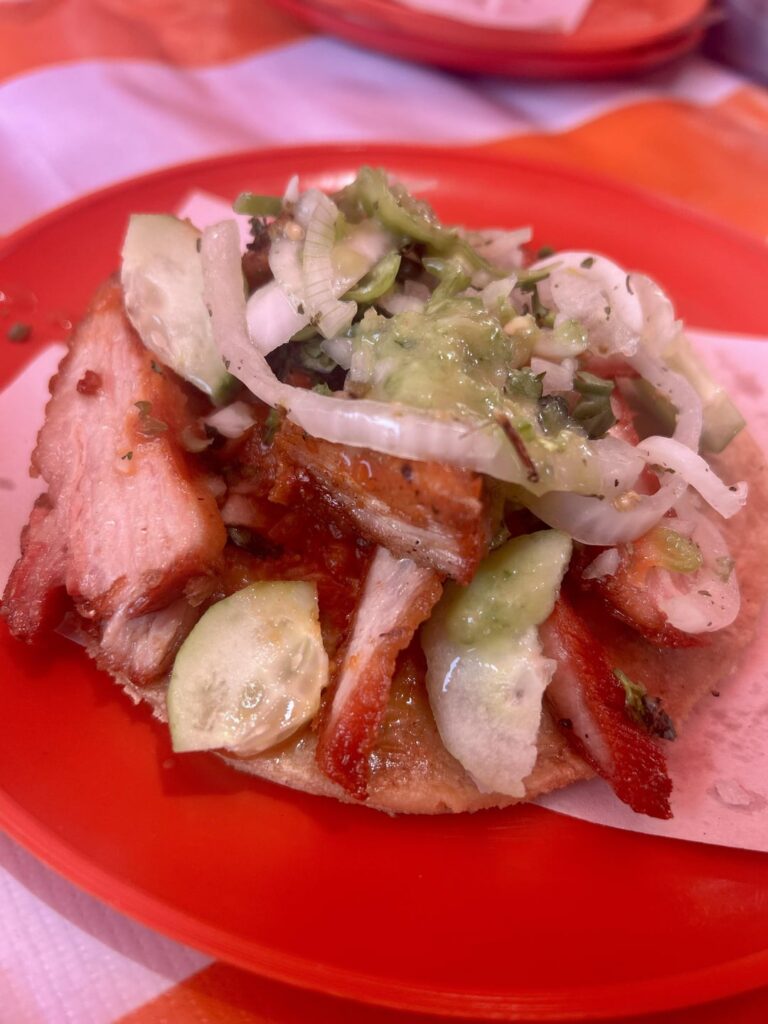 Carnitas de cachete from my favorite spot – topped with encurtido, cucumber, and spicy habanero salsa