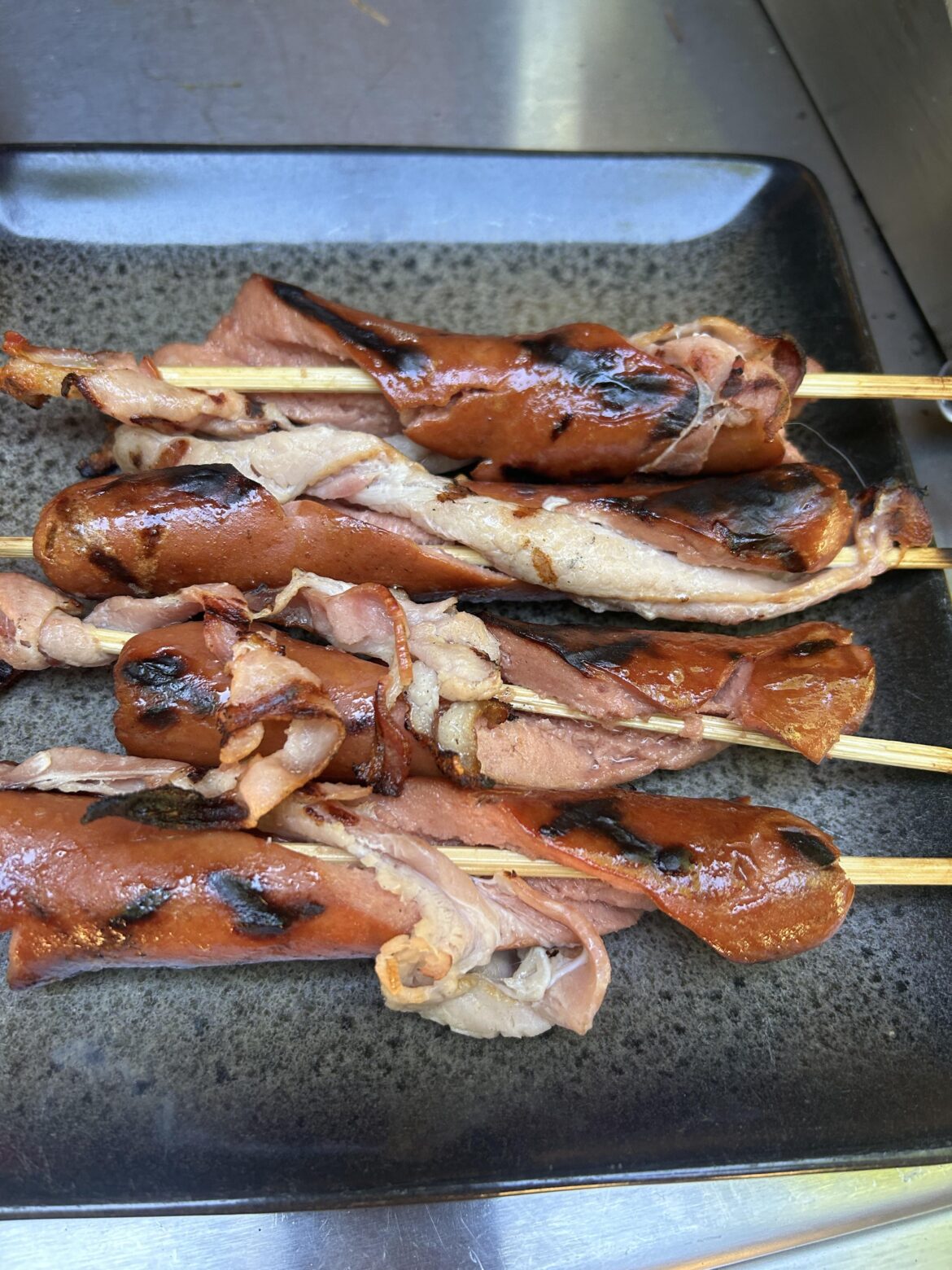 Bacon stuffed wieners on a stick…a Memorial Day party item.