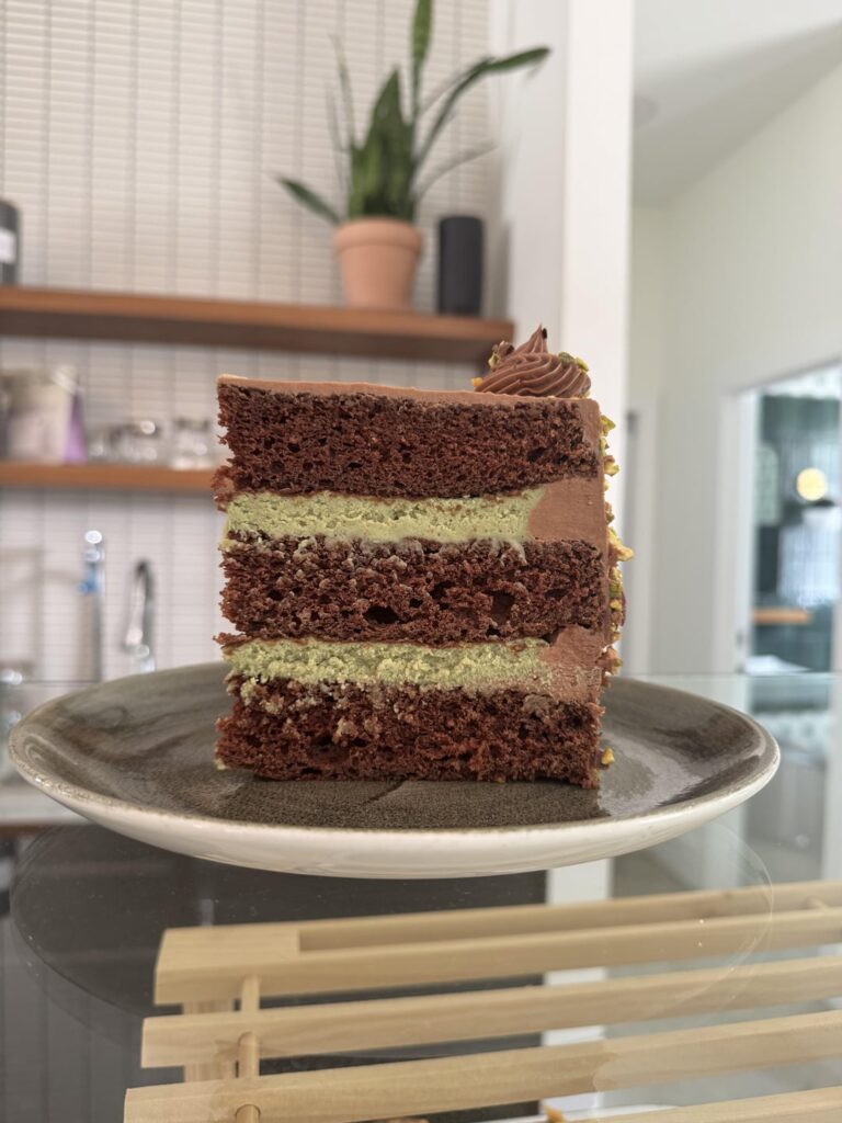 Chocolate cake, whipped pistachio ganache, chocolate Swiss buttercream 💚