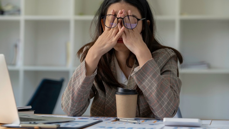 tired woman at computer