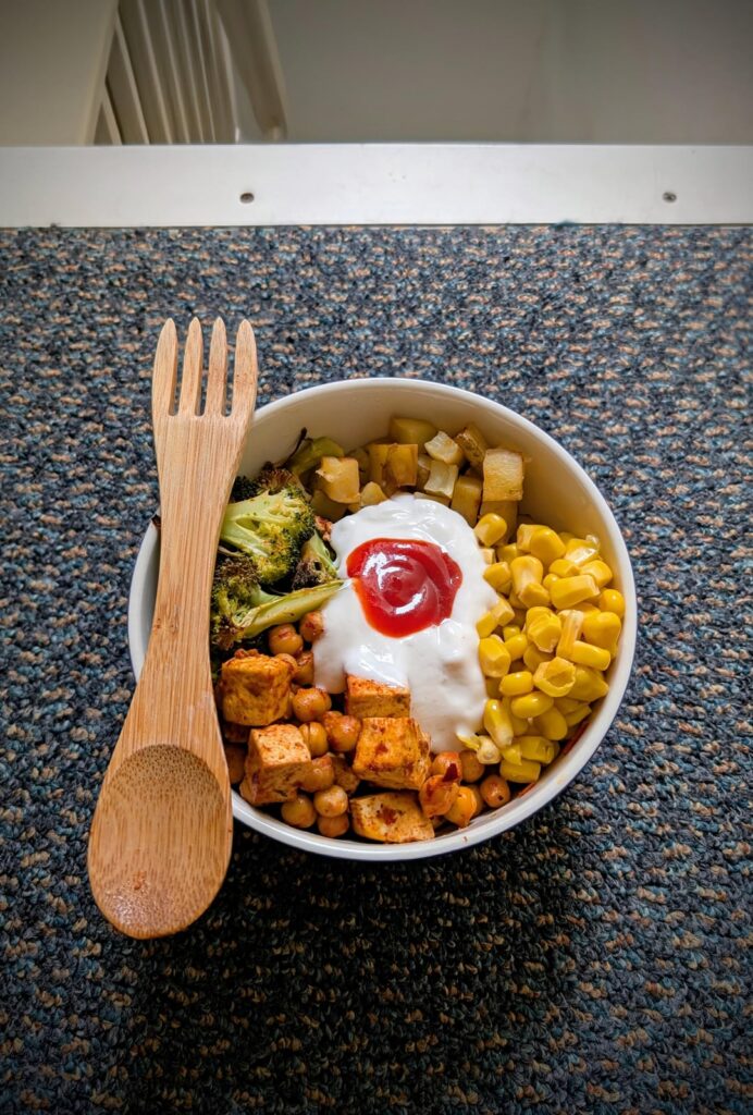 Roast veg, harissa coated chickpeas and tofu, with yoghurt and sriracha