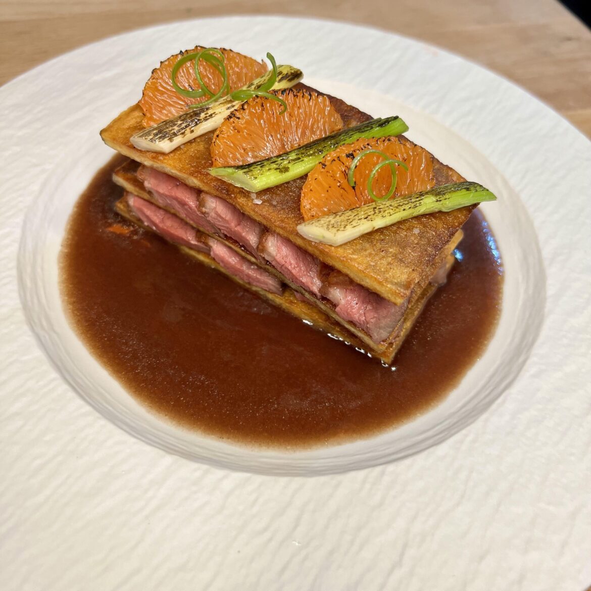 Duck Mille Feuille: Crispy Duck Breast, Duck Fat Potato, Charred Scallion and Orange