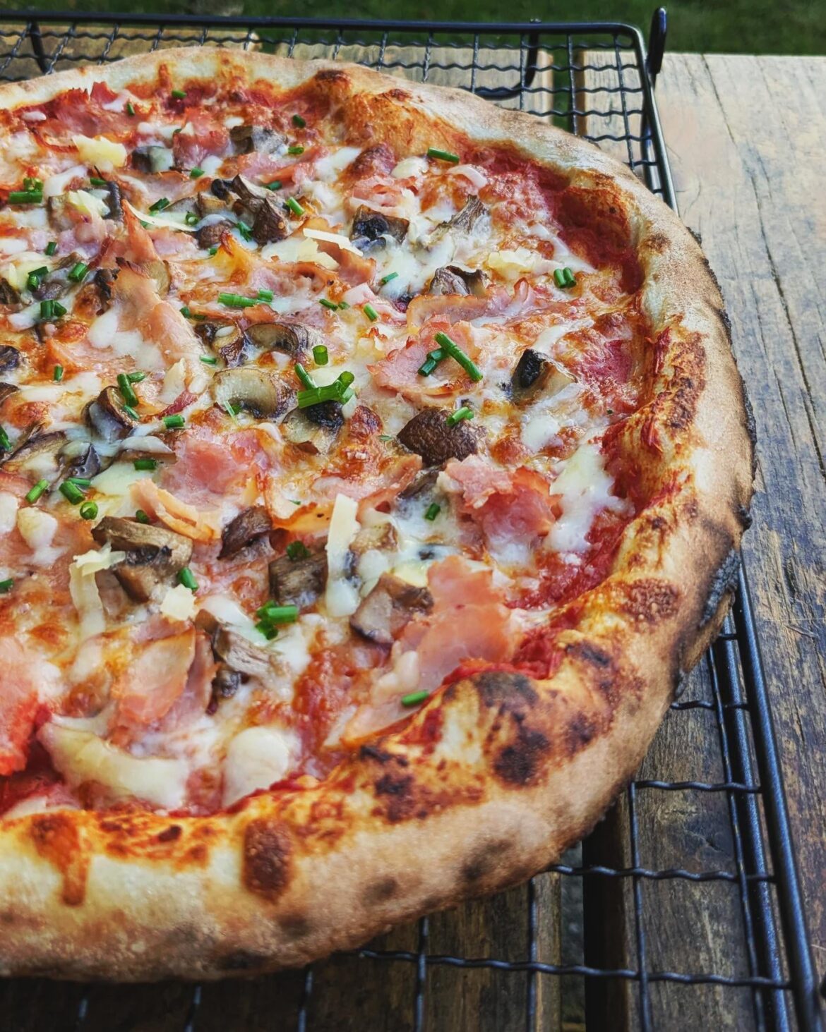 Homemade ham and mushroom pizza.