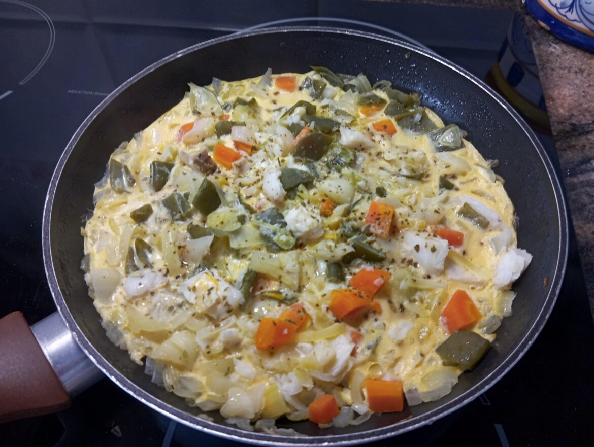 Leftover Omelette, seasoned with black pepper and herbs. The leftovers are: boiled fish and vegetables