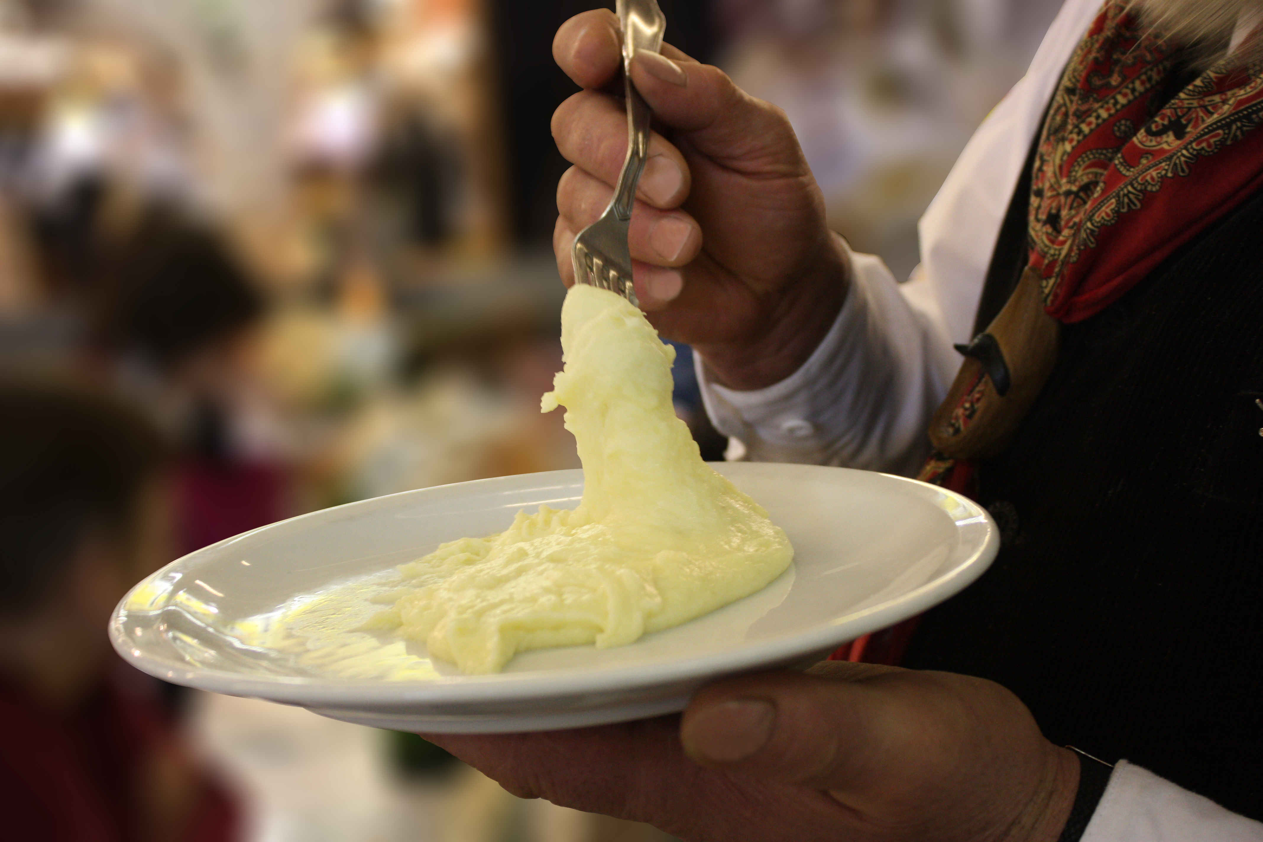 Aligot, a French dish of mashed potatoes, Tome cheese, cream, and garlic.