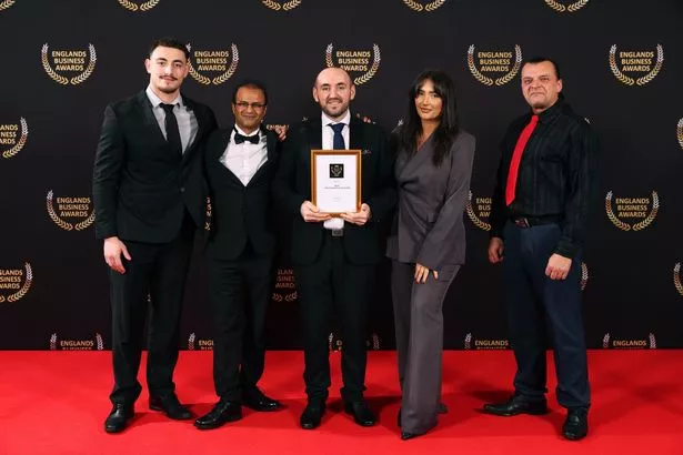 The Giuliano team, with Lulzim in the centre, accepting their Best Restaurant in England win at the weekend
