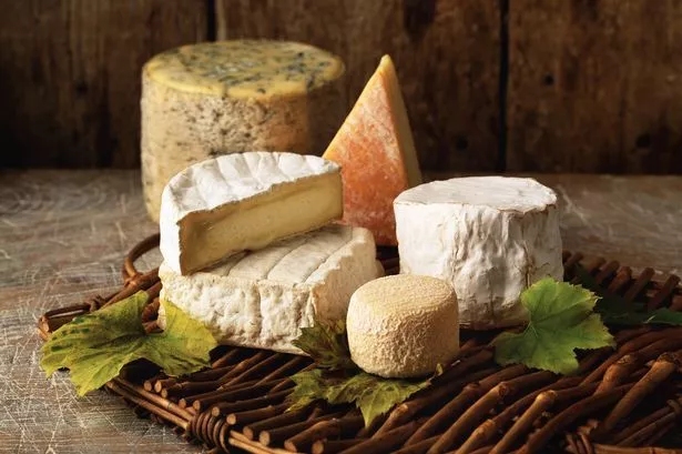 Cheese on a wooden cheese board