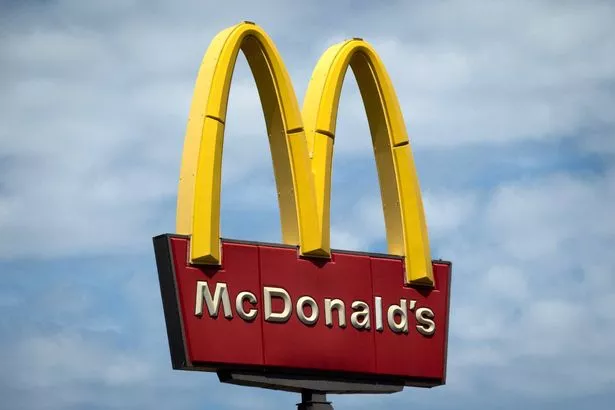 A sign towers over a McDonald's restaurant 