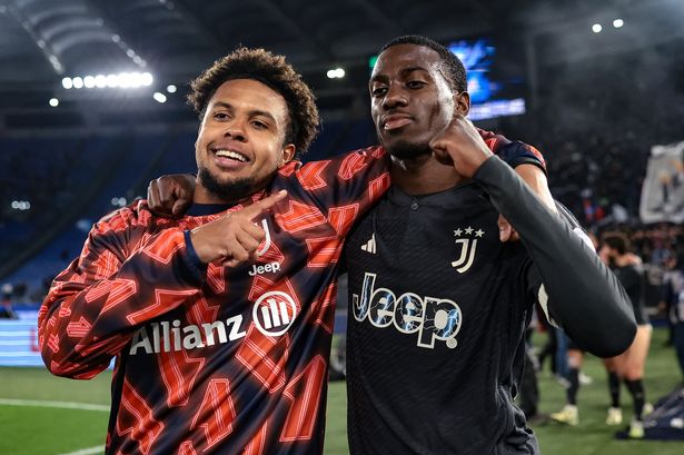 Weston McKennie and Tim Weah pose for a photo after a Juventus game