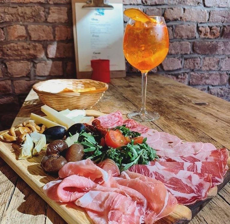 A delicious plate of cured meats, olives and cheese served at Sicilian Food NQ in Manchester