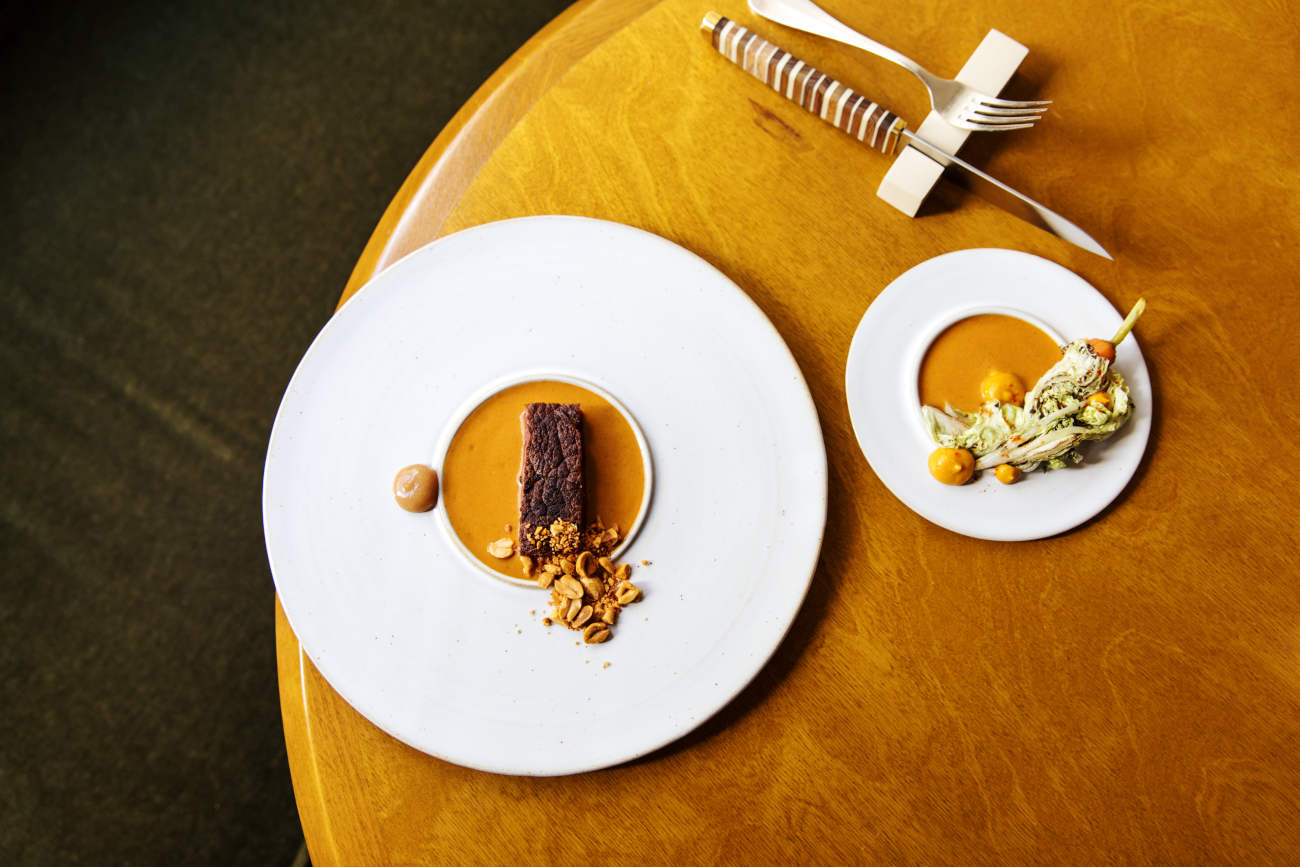 At MoSuke, Aubrac beef matured in shea butter, mafé sauce, fonio, tamarind