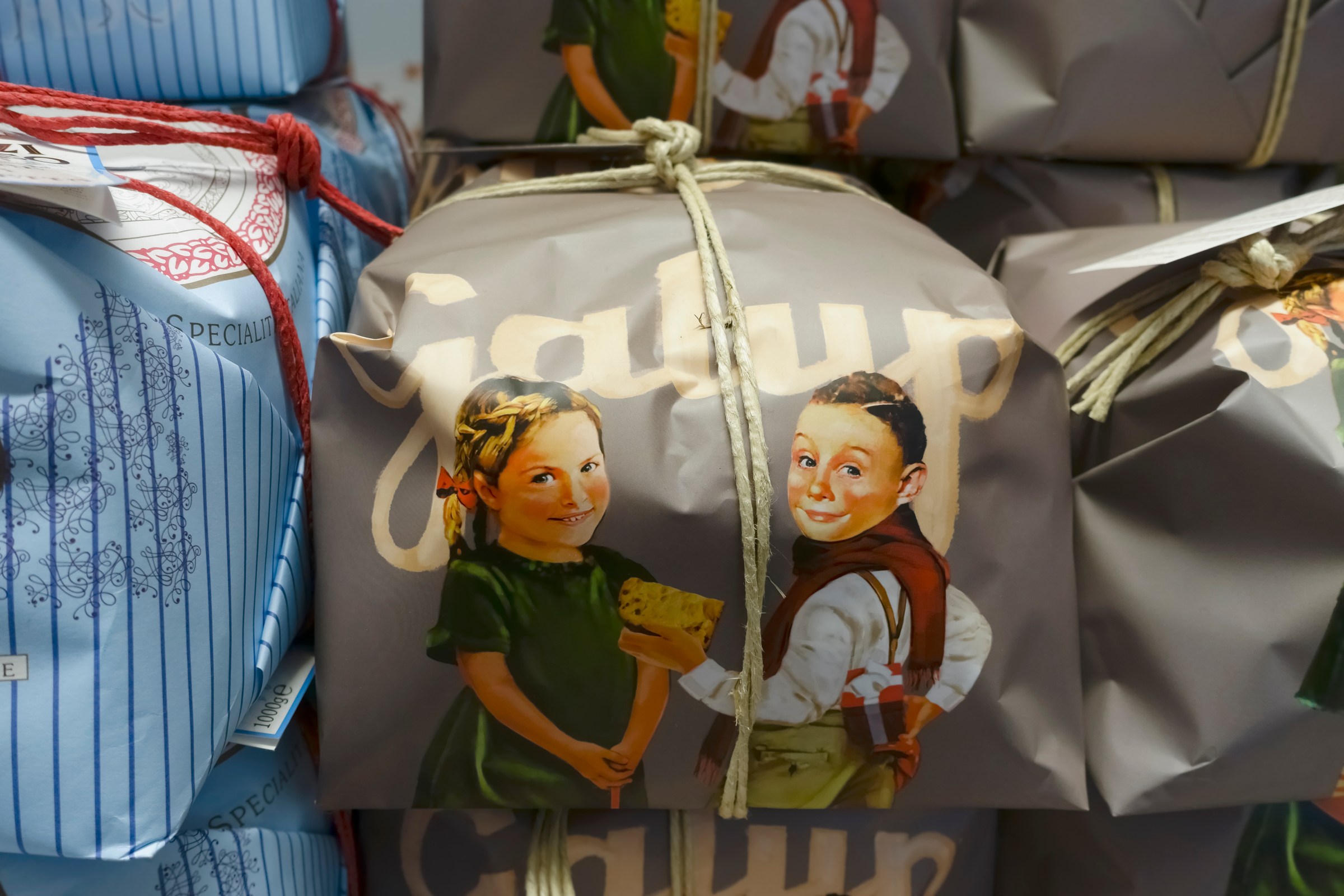 Boxed Panettone, Italian traditional Christmas fruit sweet bread loaf from Milan Italy, on display in a store.