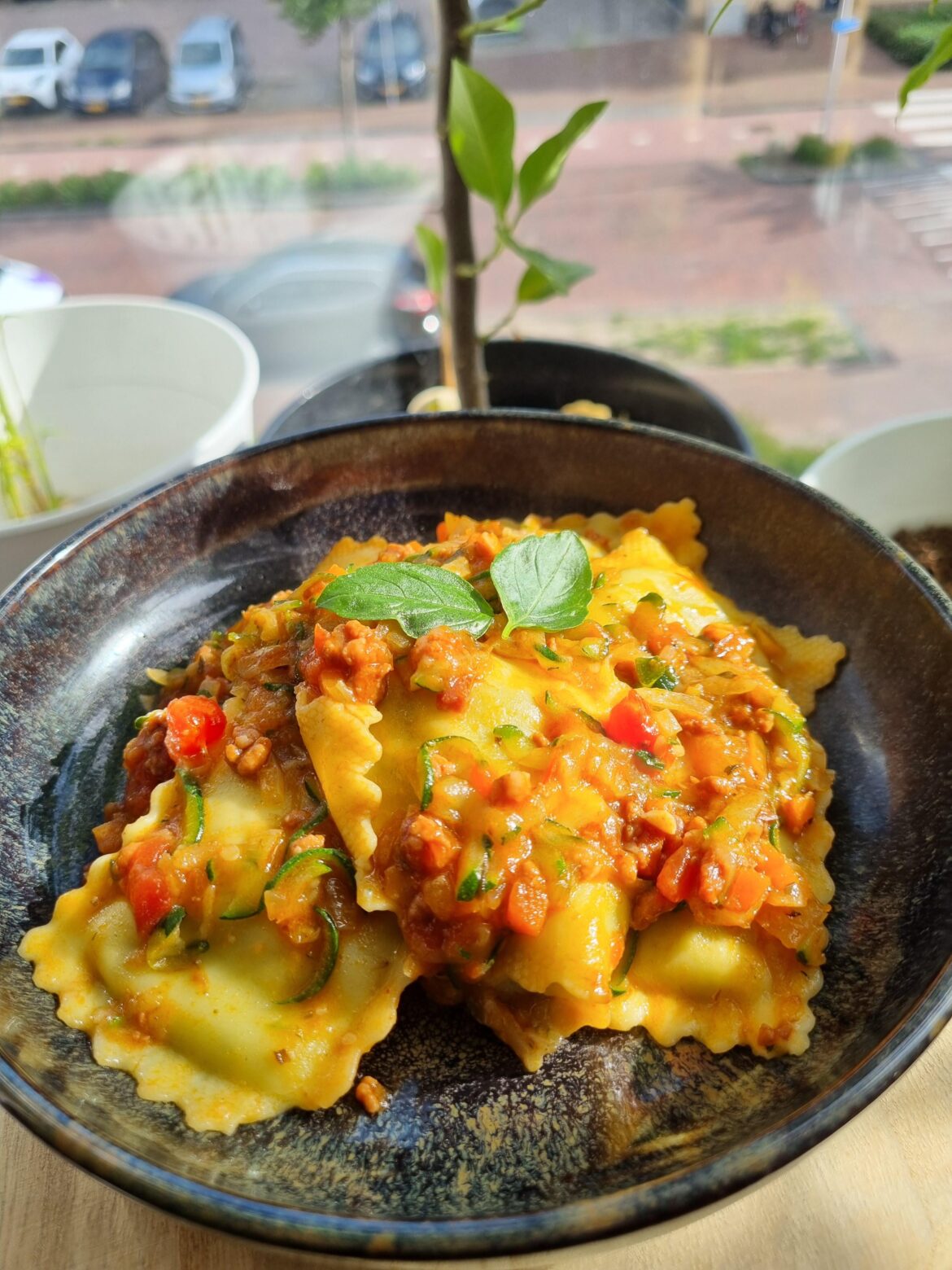 Bolognese al ragu with spinach ricotta ravioli