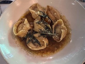 Ricotta and gorgonzola agnolotti… six pieces plated in a round. Photo: Wendy Johnson