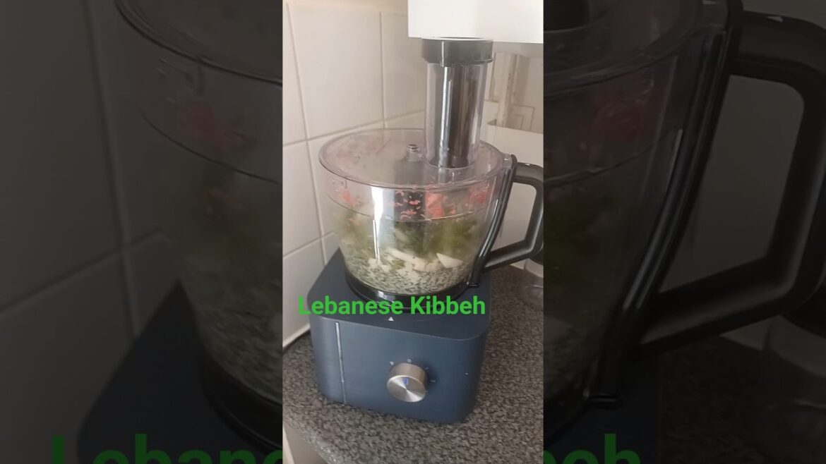 Lebanese Kibbeh - adding the onions garlic herbs 7 spices and kamouneh into the mix