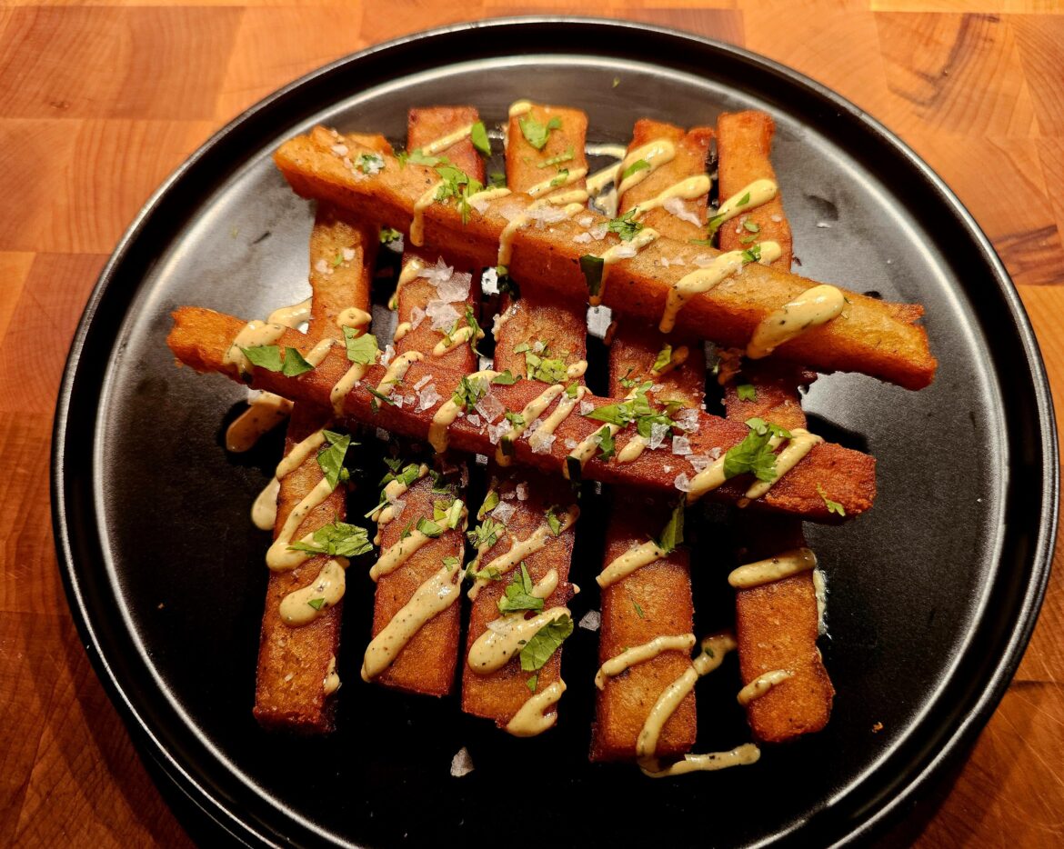 Crispy Japanese long fries with a creamy garlic sauce.