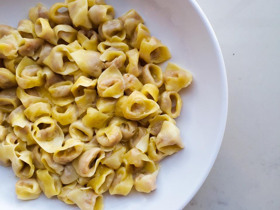 Italian tortellini pasta in white round bowl