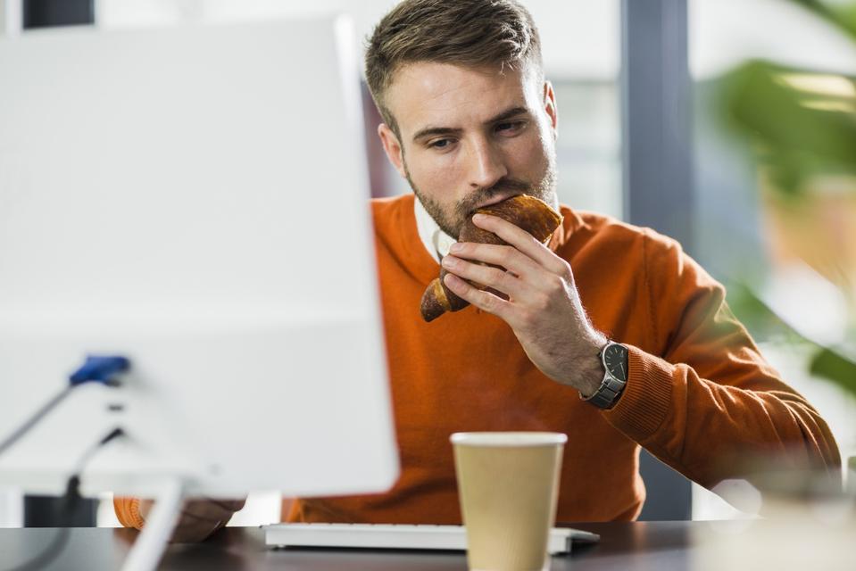 It is no longer illegal to eat at your desk at work due to Covid-19
