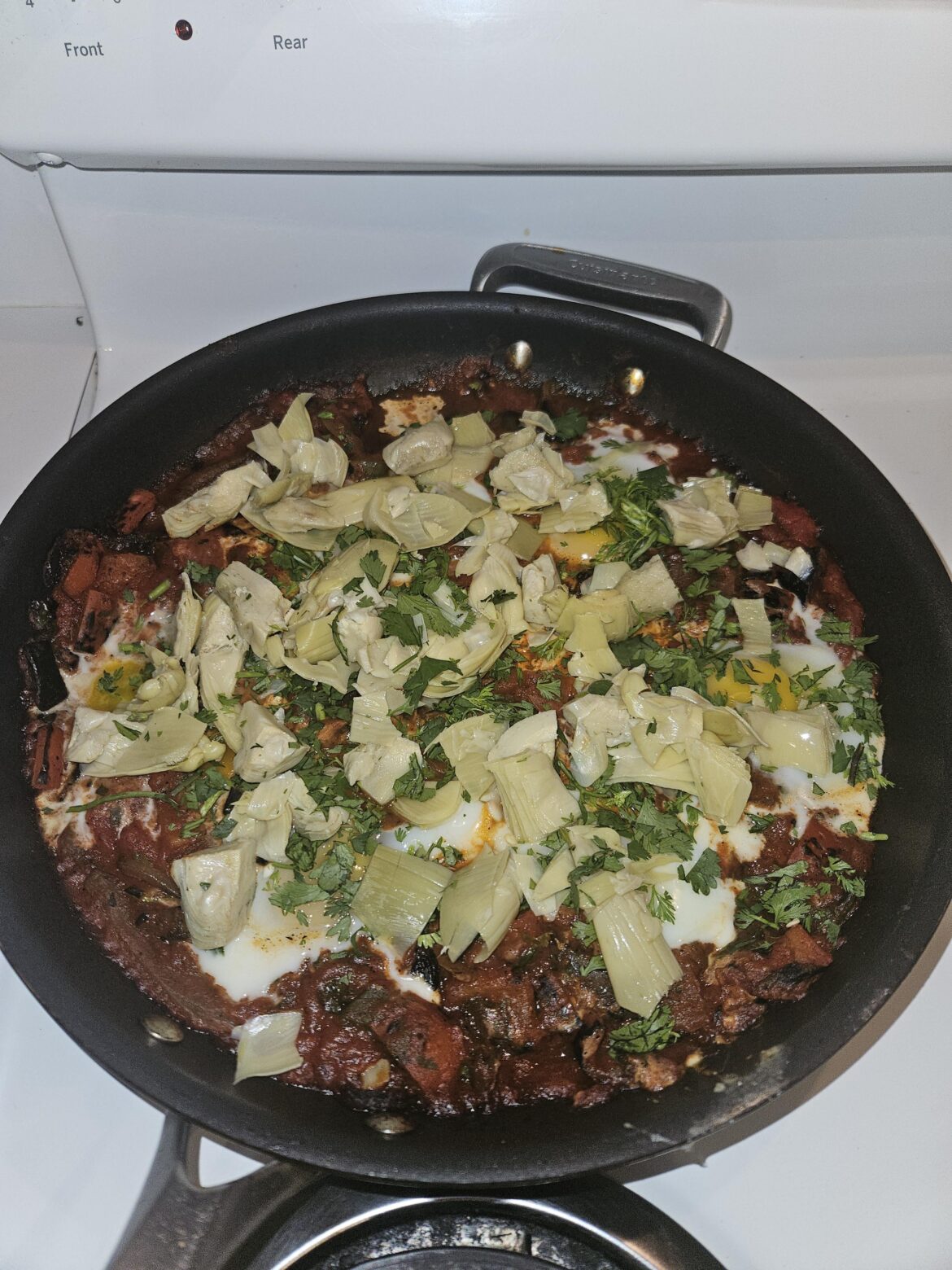 Made Kenjis Shakshuka with a bunch of artichoke hearts as toppers.