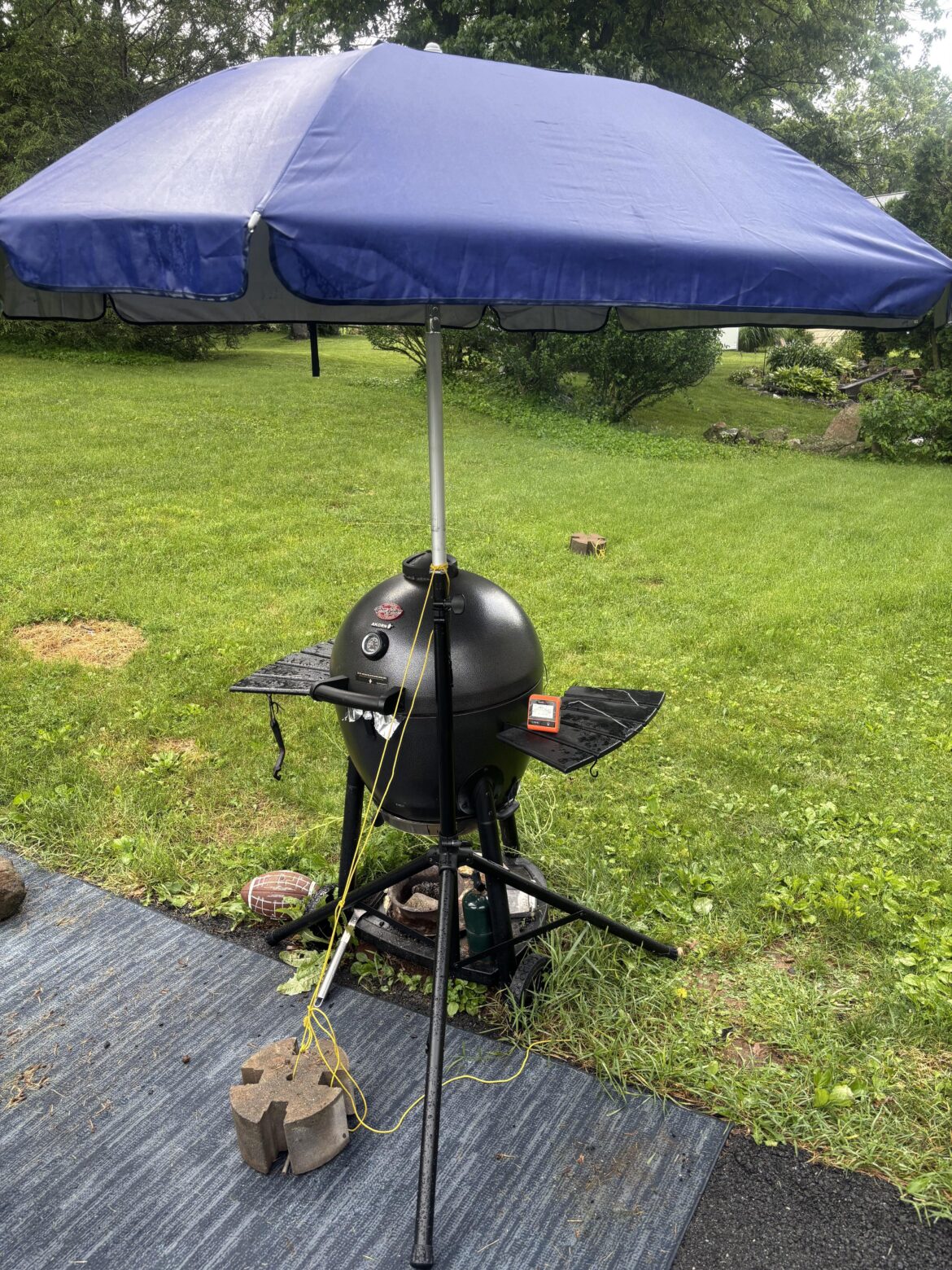 Thunderstorms are no match for my Costco beach umbrella and Amazon Basics speaker tripod