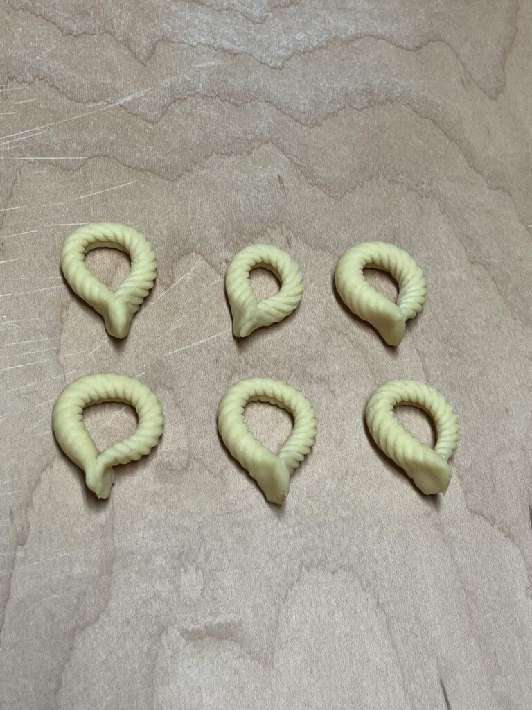 Spizzulus with a smothered onion sauce