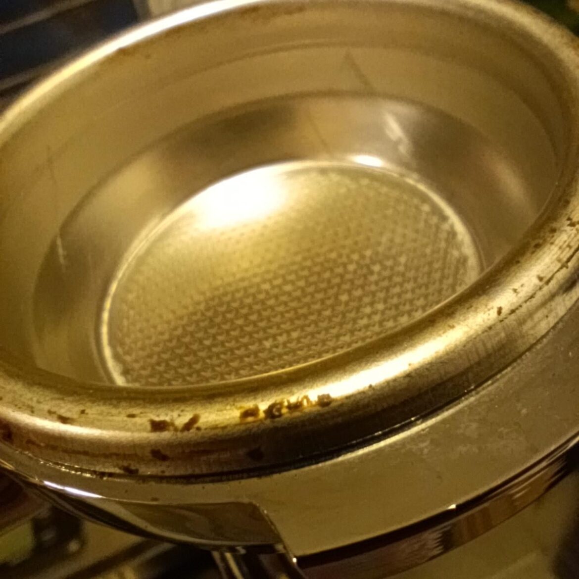 Coffee crust on portafilter Coffee crust on portafilter