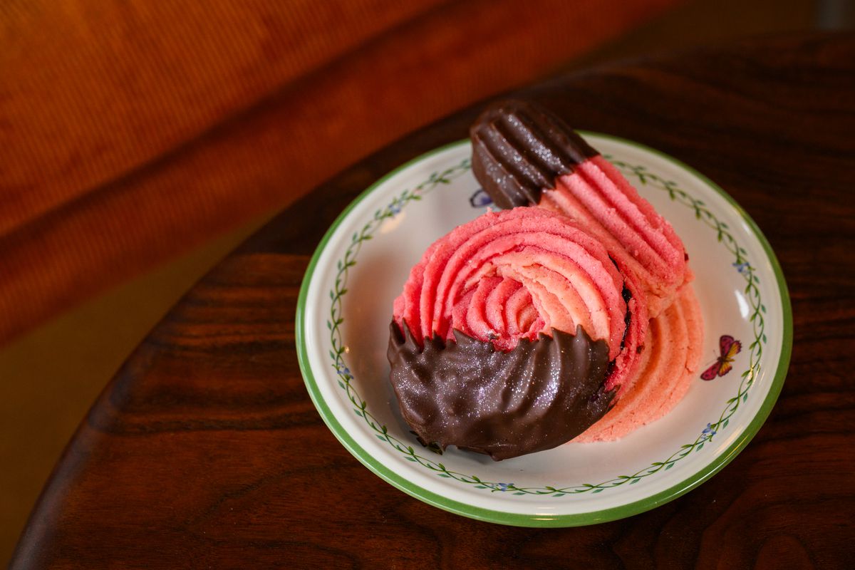Marionberry butter cookies at Flour Bloom arrive dipped in chocolate with edible glitter. 