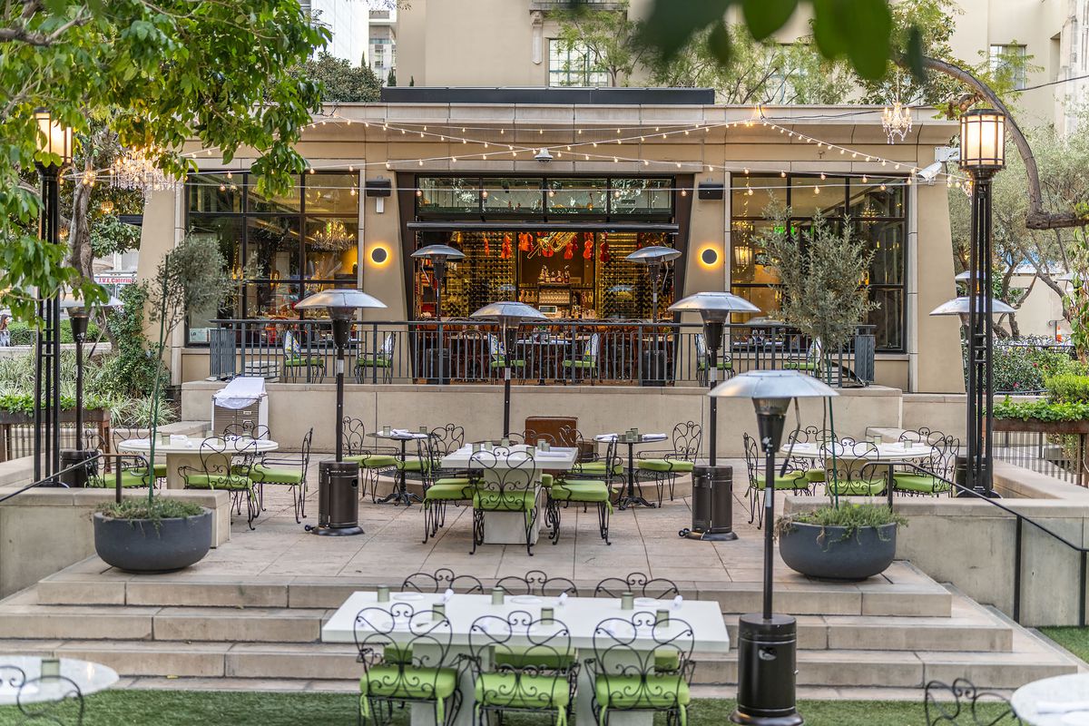Patio seating with green chairs.