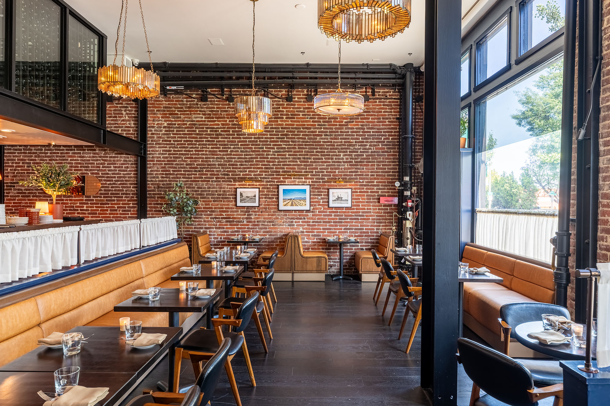 The simple brick-walled dining room of LA restaurant Cannonball.