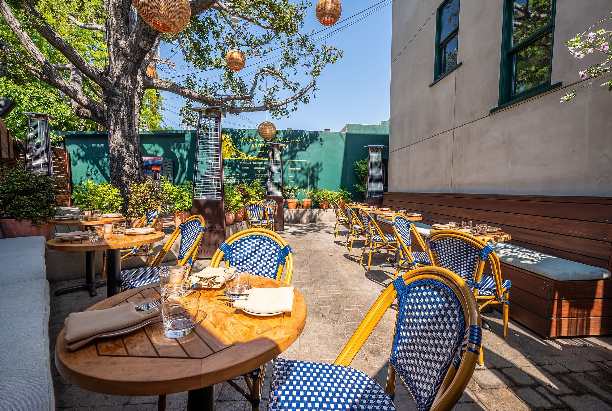 Cannonball patio with blue French cafe chairs. 