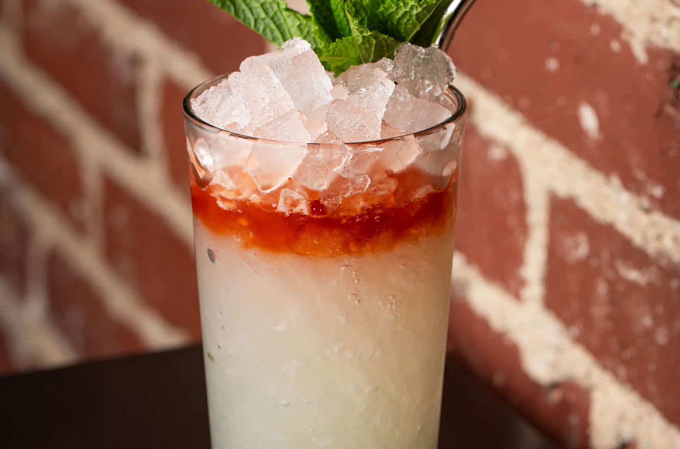 A refreshing tropical-style drink with mint garnish.