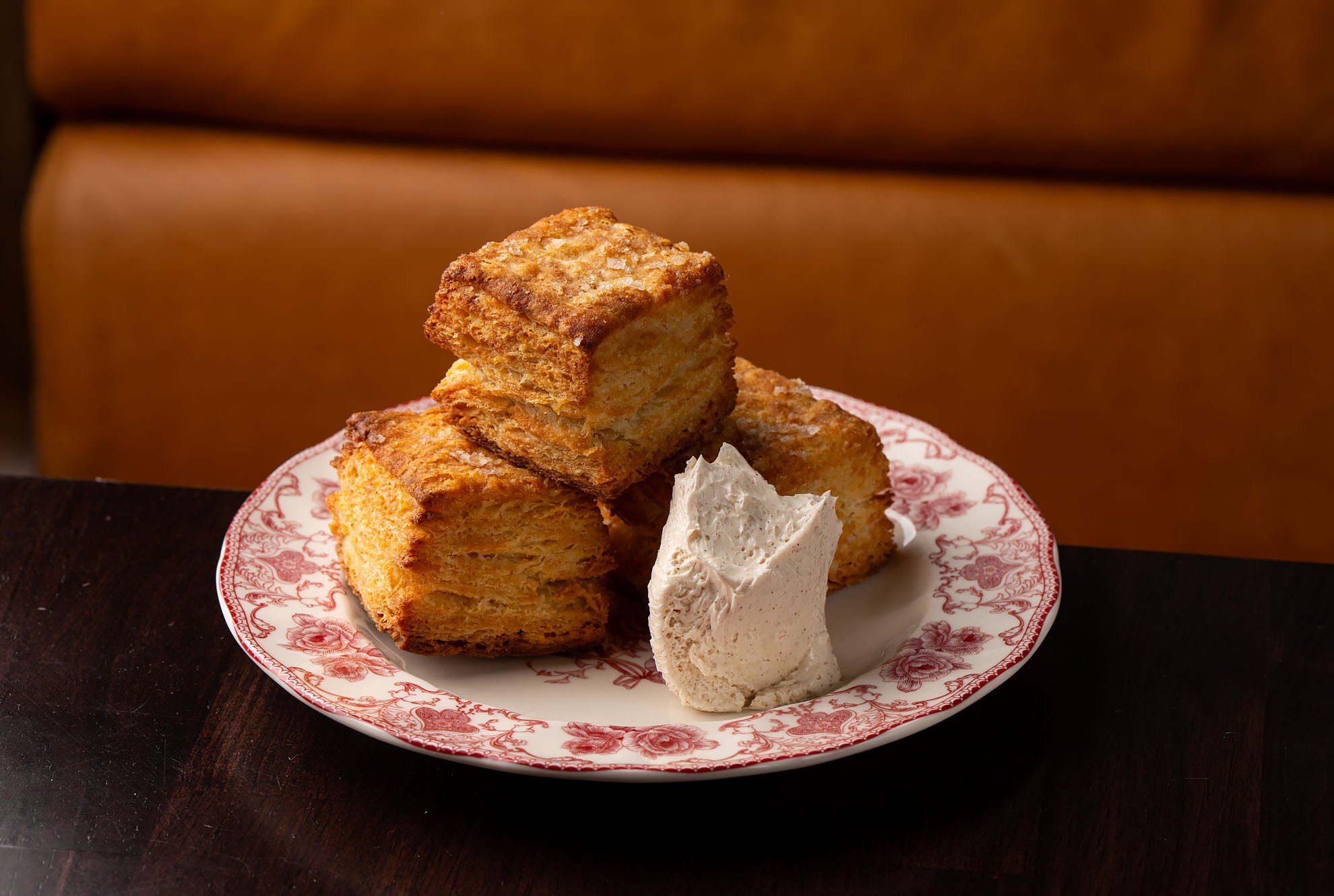 Three cubed biscuits with a smear of softened butter.