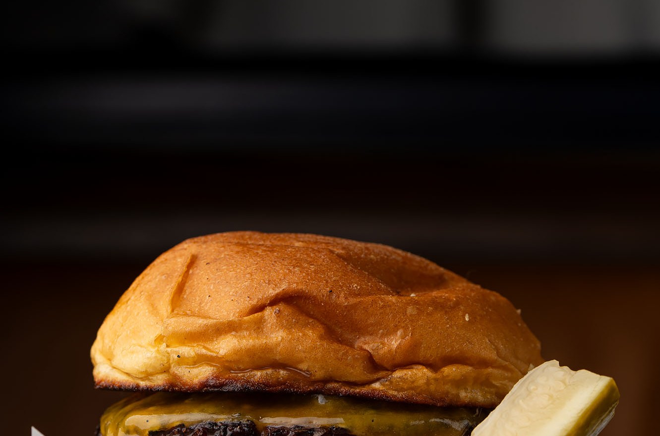 A plush burger with pickles.