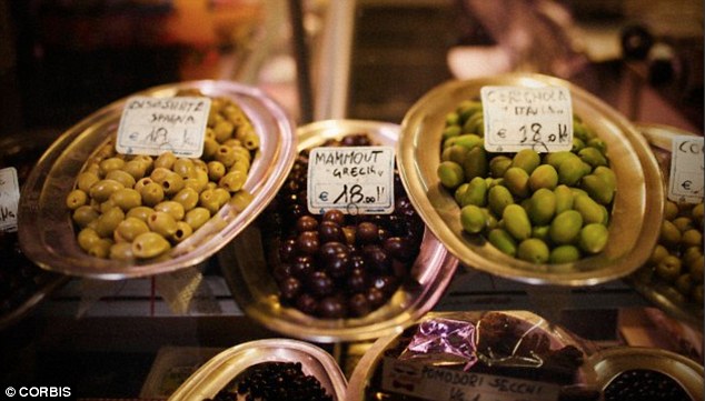 The Mediterranean diet, comprising of fresh fruit and vegetables, whole grains, nuts, beans, olive oil, fish and red wine, is as healthy as being vegetarian, a study has found