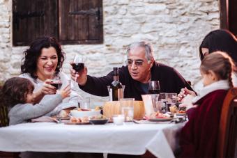 Italian family from Cyprus eating dinner outside
