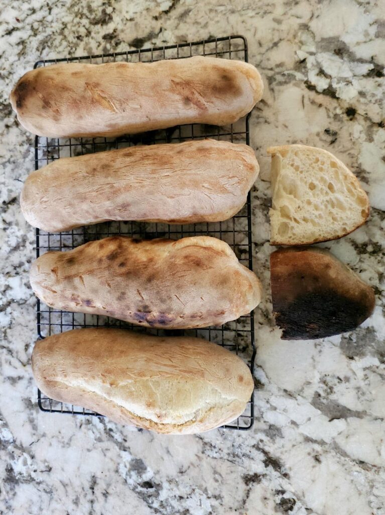 Progression of baking bread using my pizza oven for the first time.