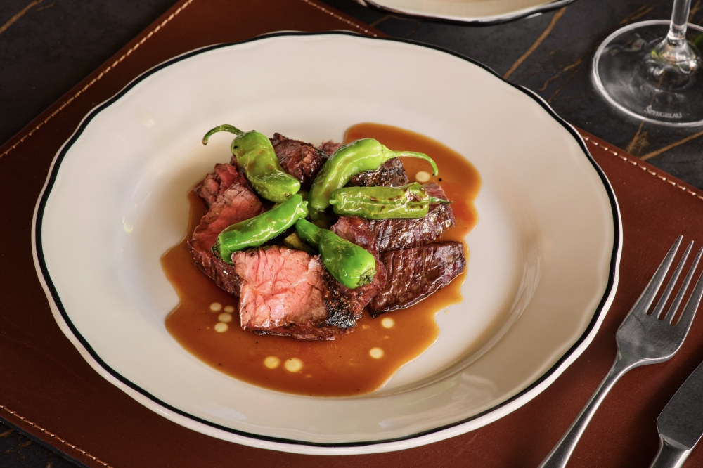 Le Calamar now offering French-Texas fusion dishes, local wines in Austin New restaurant Le Calamar offers French dishes with Texas twists, such as the Gyulai sirloin flap with cafe de Austin butter and shishito peppers. (Courtesy Clay Grier)
