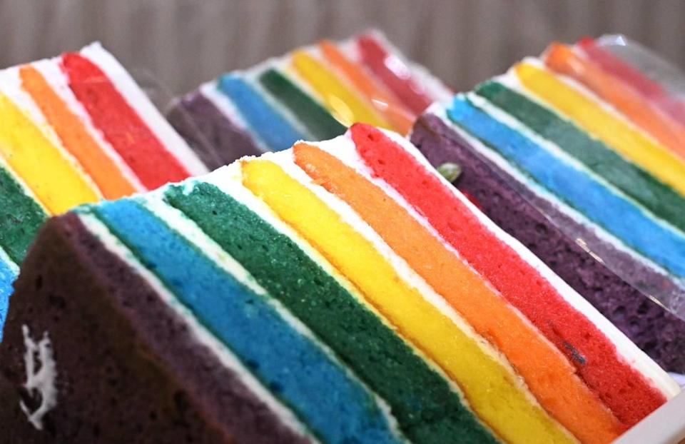 Tall slices of rainbow-colored cake sit in the case at Rustika Cafe & Bakery located at Herndon and Willow avenues in Clovis.