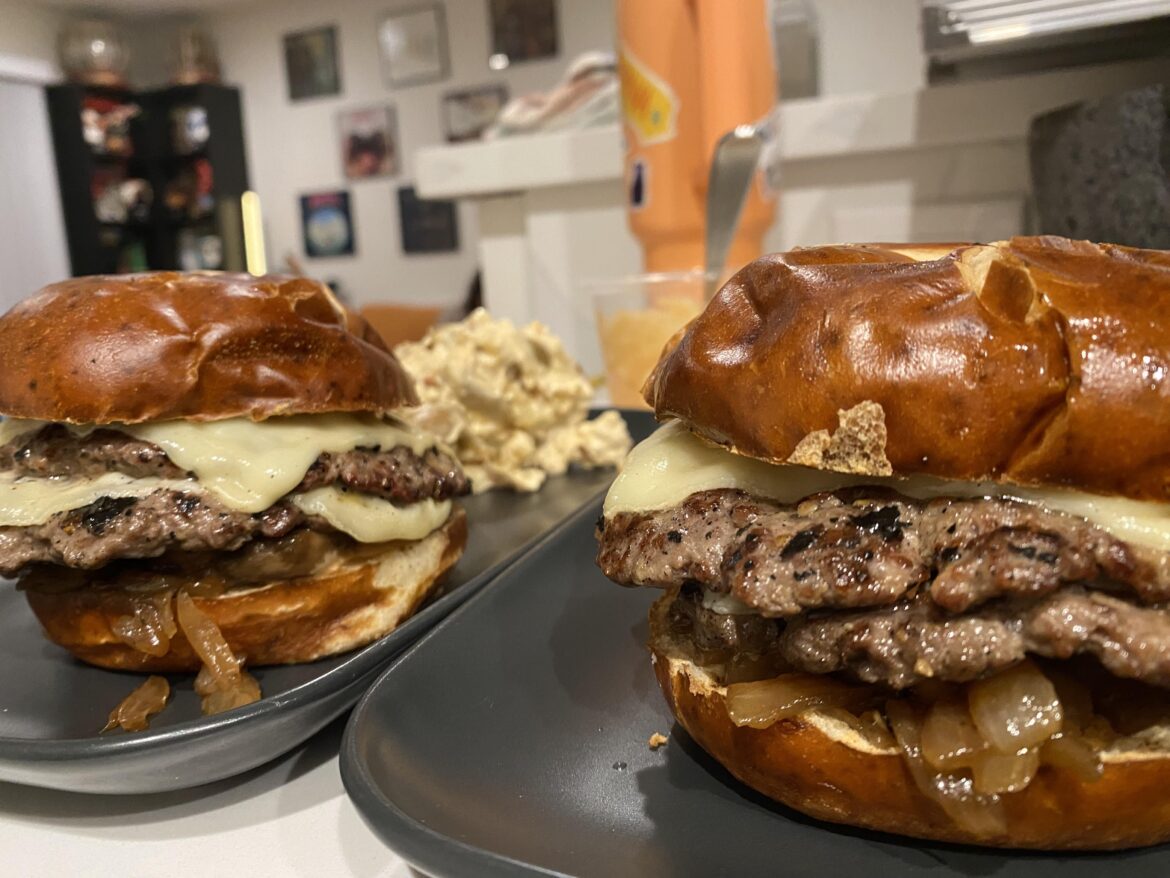 Double quarter-pounder cheddar gruyere with grilled onions and mushrooms on a pretzel bun. Only four beers deep.